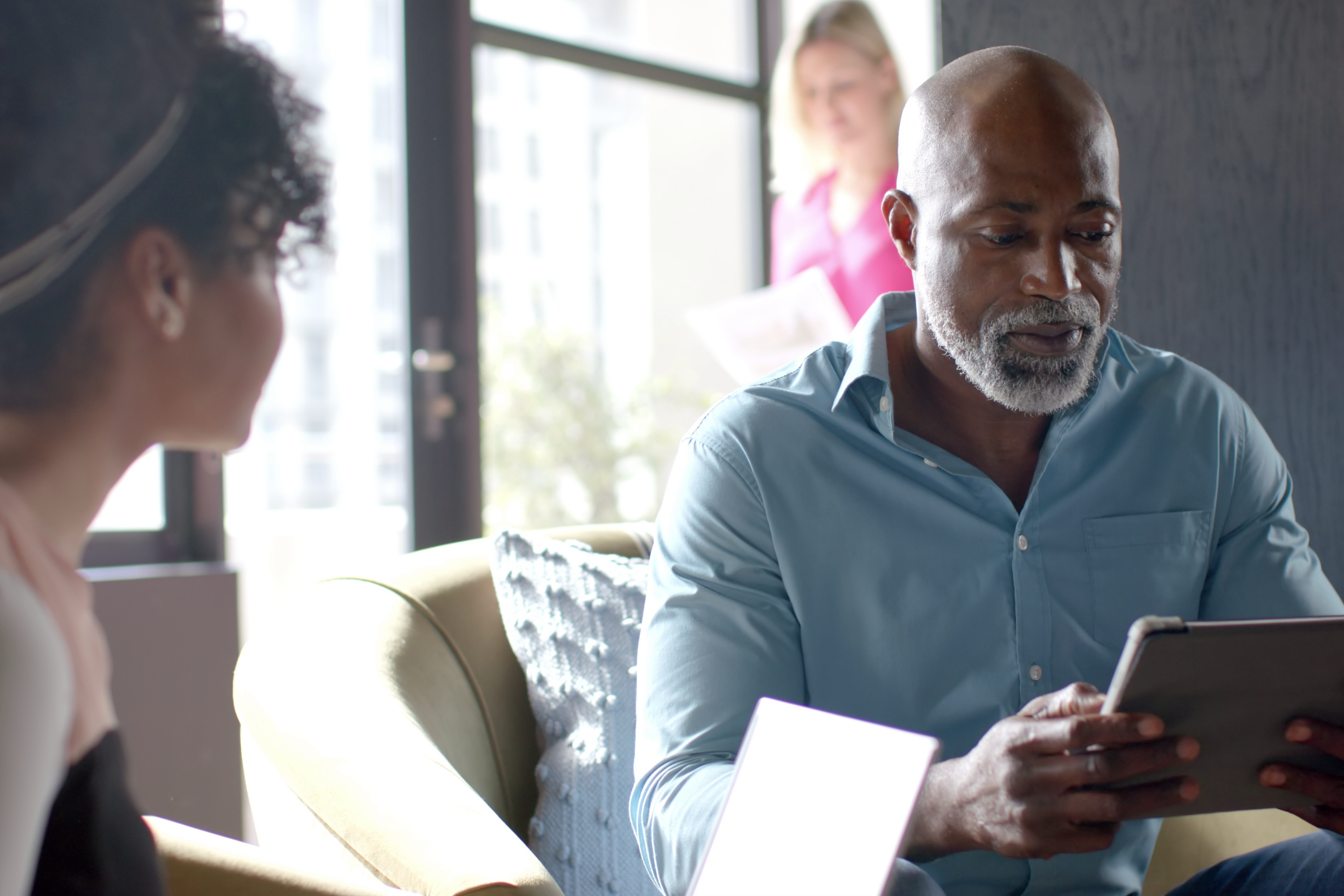 business-african-american-man-reviews-documents-in-an-office-setting-SBI-351123201